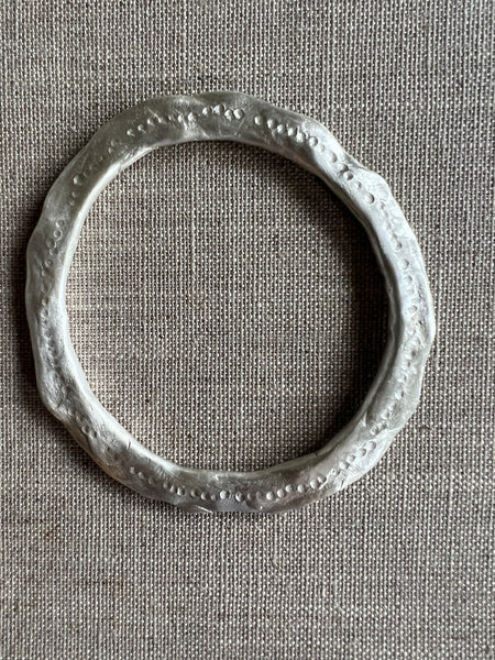 CAST SILVER - Bangle in solid sterling silver with hammered detail